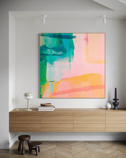 I AM CALM – PAUSE fine art print by Australian artist Ash Badios, featuring layered turquoise, emerald green, soft peach, pink and apricot brushstrokes, displayed above a floating timber sideboard in a minimalist contemporary interior with herringbone flooring.
